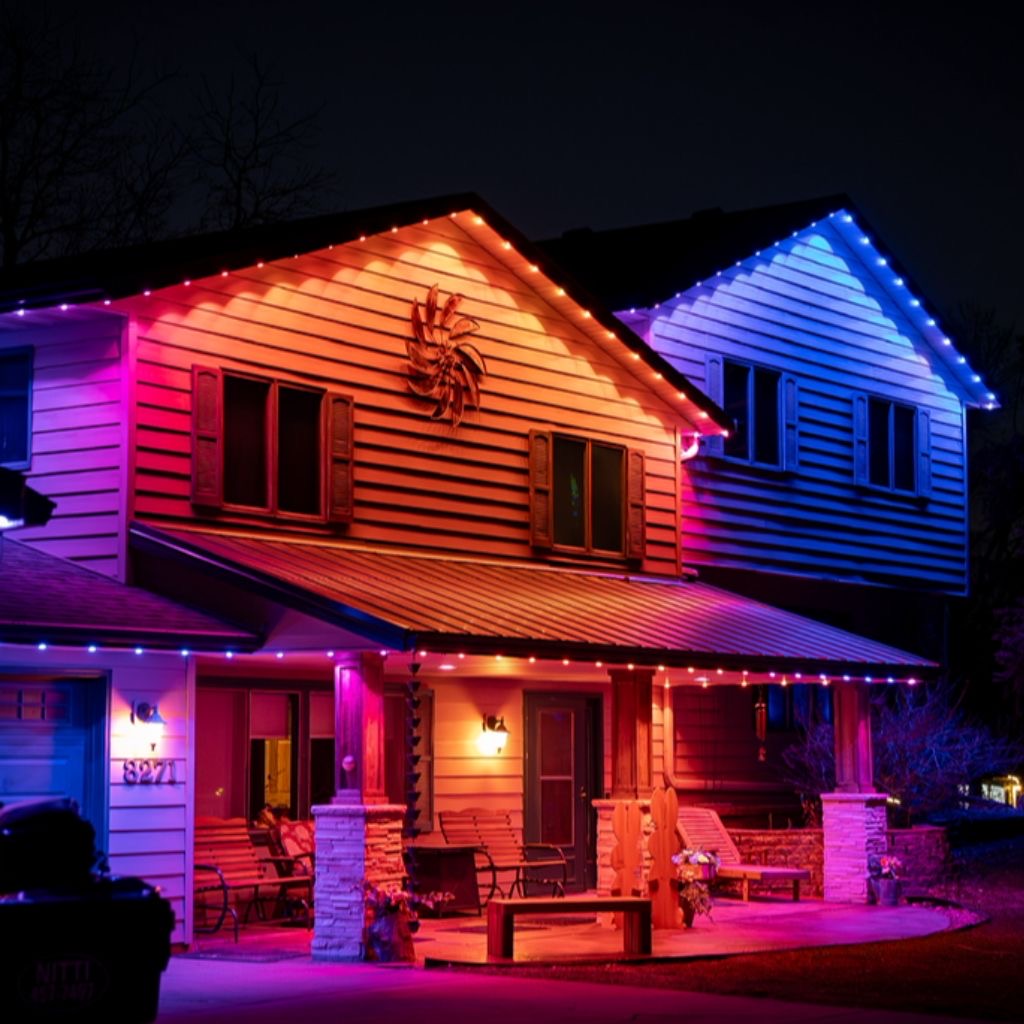 Vibrant color-changing permanent lighting on a two-story home